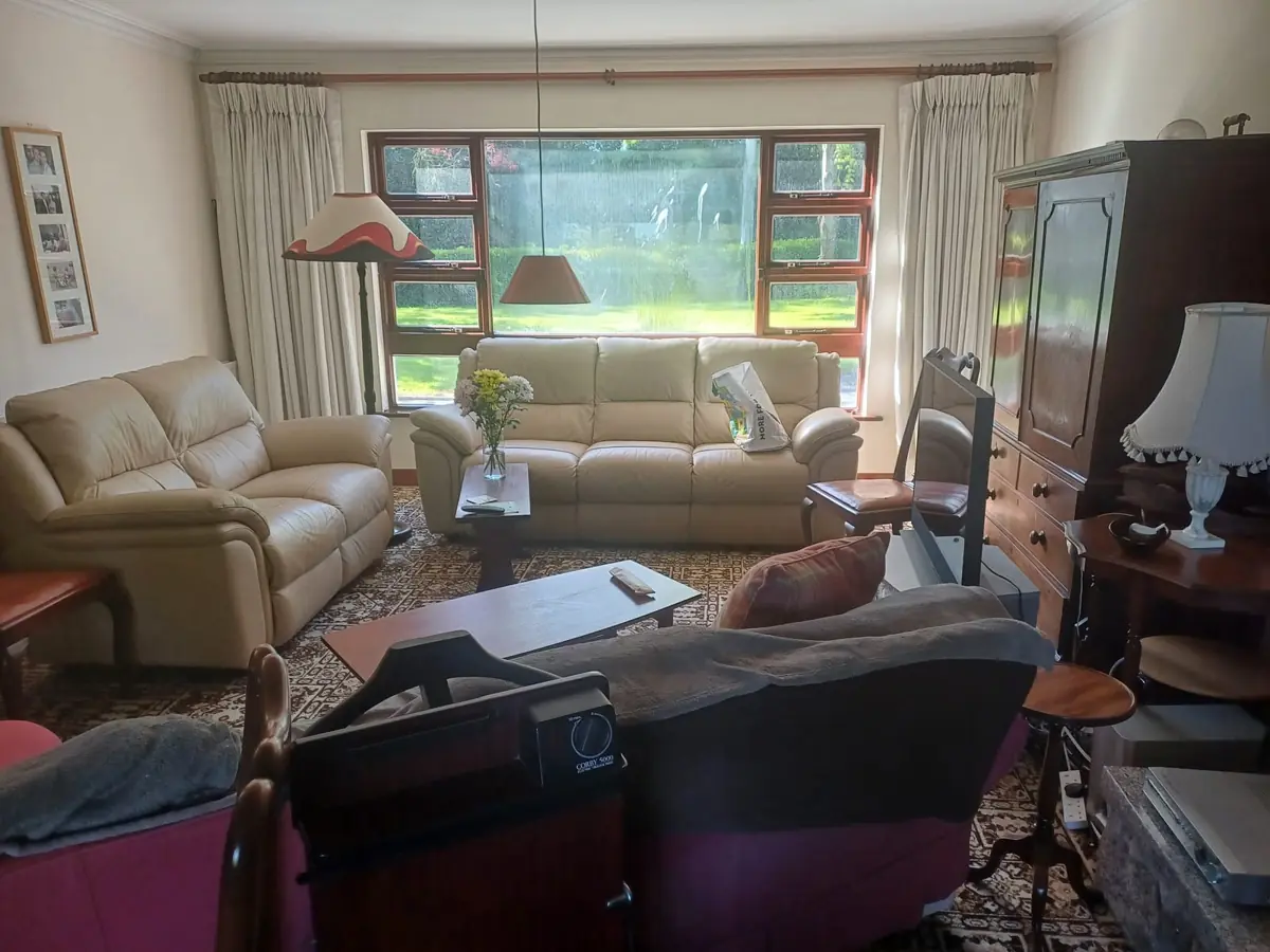 Living room full of furniture before a house clearance in Dublin